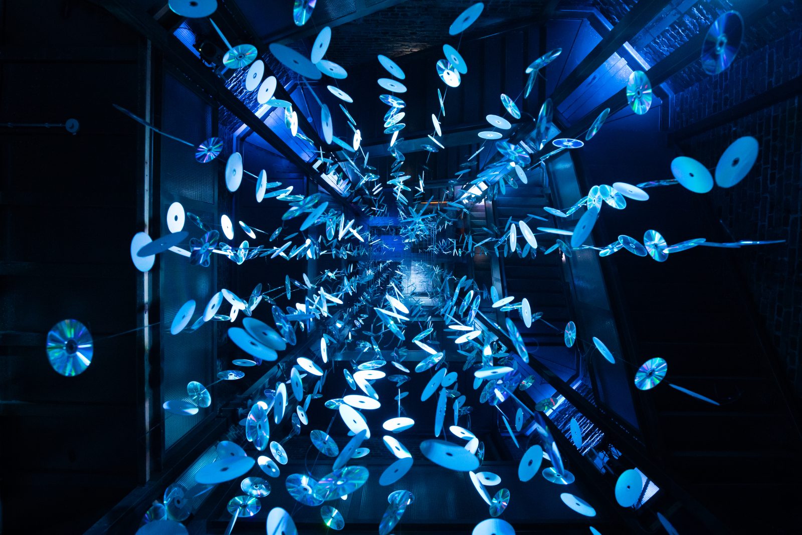 A light artwork made of hanging CDs at Lumo Light Festival Oulu 2021.